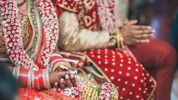 Bride fires gunshots while groom stays mum on wedding stage