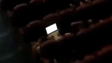 Bengaluru techie spotted working on laptop inside movie theatre, video goes viral
