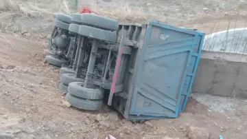 Dumper Truck Overturns After Running Over Three