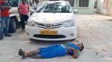 Woman sleeps in front of estranged husband’s car