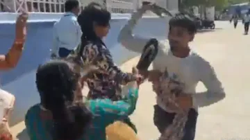 Woman hits husband with slippers, locks horns with 2nd wife on road; watch what happens next