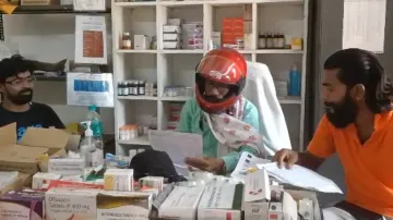 Doctor treats patient wearing helmet