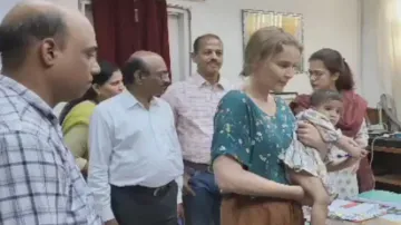 Sambalpur Collector Ananya Das handed over the baby to her foster parents 