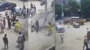 Woman chases father-in-law on road, thrashes him with iron pipe, watch