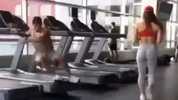 Youth slips from treadmill while ogling girl, watch how smartly he manages situation