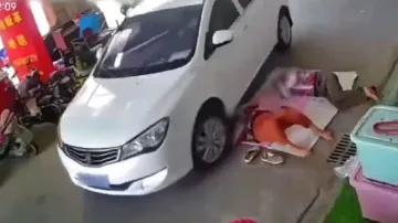 Shocking! Sleeping woman run over by car, escapes certain death miraculously; watch