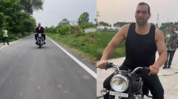 Royal Enfield Bullet looks like a toy in front of the Great Khali