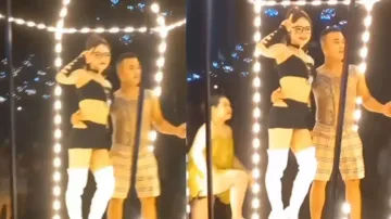 Man walks near stripper to click photos, gets spotted by wife; watch what happens next