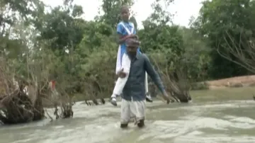 Man Crosses River Carrying Daughter To School 