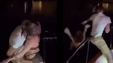 Man throws woman into water after getting caught by girlfriend while kissing; watch