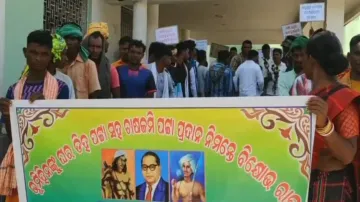 Adivasi families stage dharna