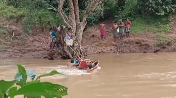 Locals carry dead body using cable to cross river