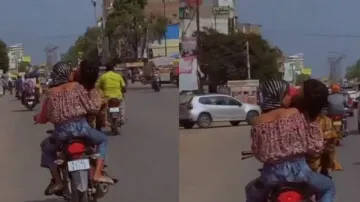 Couple Kissing on Bike