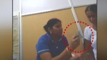 Nurse Distributes Money In Bolangir Hospital