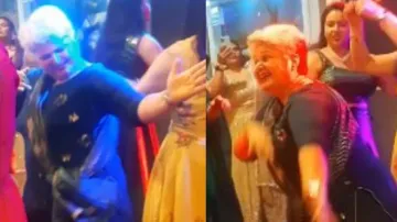 Elderly woman dancing Bhangra. 