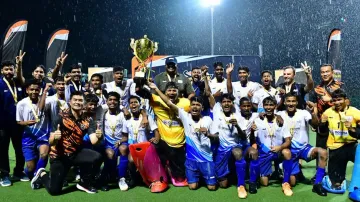 Odisha U17 boys’ hockey team with the title trophy