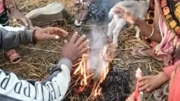 People Light Camp Fire Beside The Road