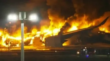 Japan Airlines plane bursts into flames at Tokyo airport; all 379 passengers, crew evacuated