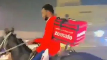 Zomato delivery boy delivers food on horse amid long queues in petrol pumps