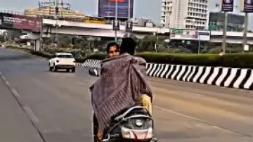 Watch: Couple cuddles on moving scooter in Mumbai; netizens react