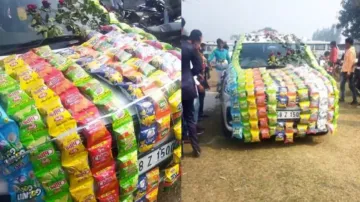 Groom reaches wedding venue in car adorned with potato chips packets