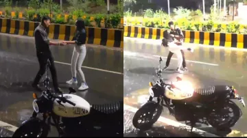Young couple's rain dance in the middle of road triggers netizens, watch how they react