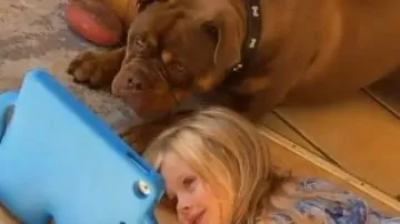 Parents' plan backfires as both daughter and puppy get hooked on phone