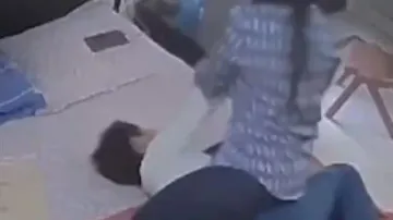 Mother caught punching, beating up 11-year-old son