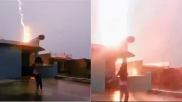 SHOCKING! Extreme lightning strikes while young girl records reels amidst heavy rainfall, watch her 
