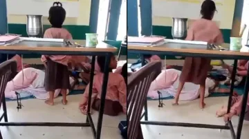 UP teacher sleeps in classroom while students fan her