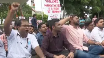 Doctors at SCB Medical College and Hospital stage protest