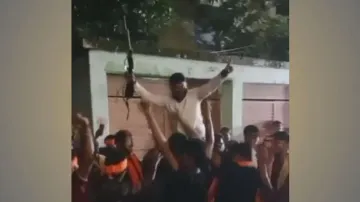 Bhubaneswar Corporator dances waving 'gun' during Ganesh puja immersion!
