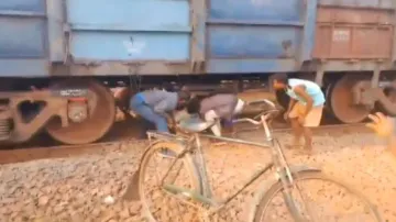 Menace of non-motorable road: Patient carried beneath halted goods train to reach ambulance in Odish