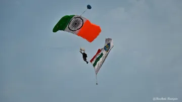 Marcos commando glides gracefully through the sky, proudly displaying the National Flag.