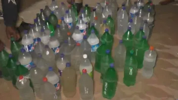 Country liquor concealed in cold drink bottles seized during smuggling in Odisha, 3 arrested