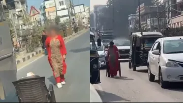 Middle-aged woman causes traffic jam as she shoots reel in the middle of the road, watch