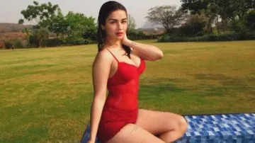 Avneet Kaur turns up the heat by swimming pool in red swimwear