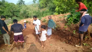 Spade in hand, groom constructs road for guests on wedding day in Odisha's Koraput