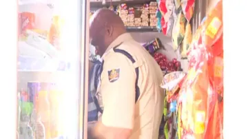 Masala shop banner in front, ganja trade inside