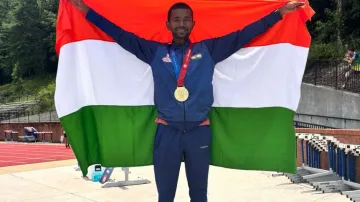 Ashok Dandasena poses with his medal