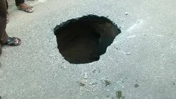 Portion of road in Bhubaneswar caves in