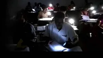 CHSE scanner on evaluation of Plus-II answer sheets in mobile flash-lights at Baripada College