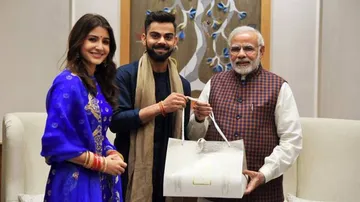 Virat, Anushka meet Modi