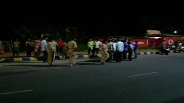 Speeding car injures two sleeping on pavement