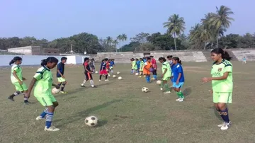 Ex-cricketer in charge of coaching budding women footballers!