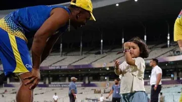 Ziva Dhoni teaches Bravo how to wear a cap in this adorable video