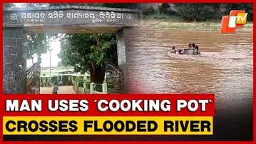 Man Uses ‘Cooking Pot’ To Carry Daughter Across Flooded River Sans Bridge