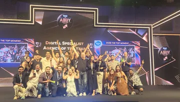 Team Enormous poses for a photo session after receiving digital specialist of the year title at the Abby Awards 2025.