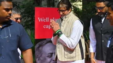 Amitabh Bachchan and Abhishek Bachchan arrive at the Shivaji Park Crematorium in Mumbai to pay final tributes to the advertising legend, Piyush Pandey, on Saturday, October 25, 2025.