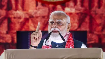 Narendra Modi speaks during the foundation stone laying ceremony of a polypropylene plant, in Golaghat, Assam on Sunday, Sept 14, 2025.